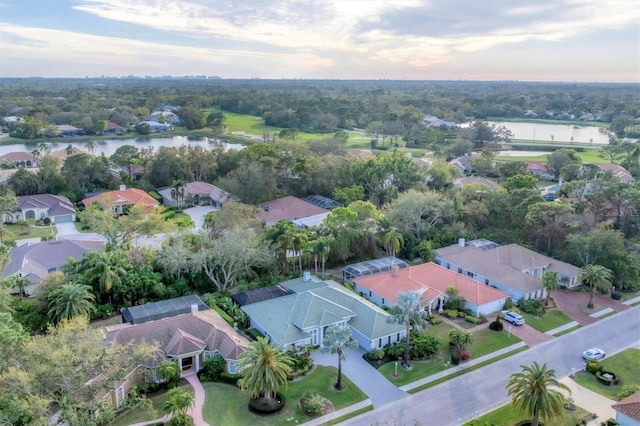 drone / aerial view featuring a water view and a residential view