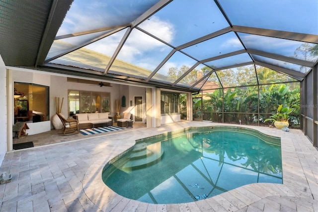 pool with a patio and an outdoor living space