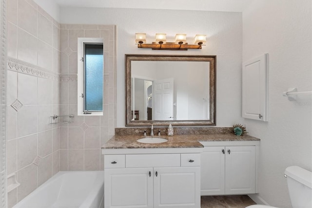 full bathroom with bathing tub / shower combination, vanity, and toilet