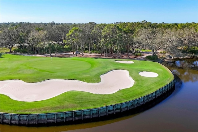 view of home's community with a water view and golf course view