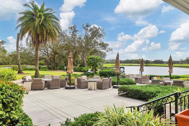 view of patio / terrace with outdoor lounge area and a water view