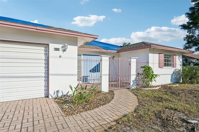 doorway to property featuring a garage