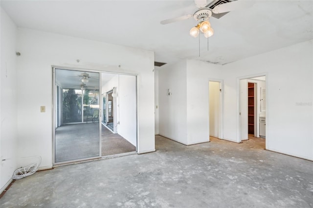 unfurnished bedroom with ceiling fan and concrete flooring