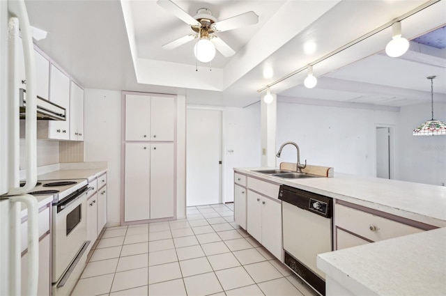 kitchen with sink, white cabinets, white appliances, and decorative light fixtures