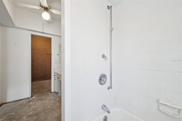 bathroom featuring ceiling fan, tiled shower / bath, vanity, and concrete floors