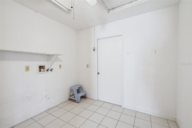 washroom with washer hookup and light tile patterned floors