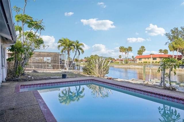 view of pool featuring a water view