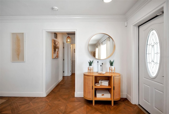 entrance foyer featuring crown molding and dark parquet floors