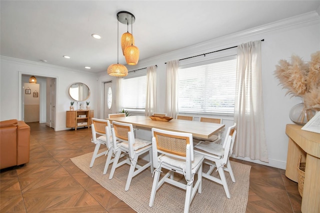 dining room featuring ornamental molding and dark parquet floors