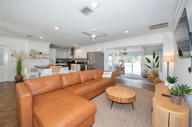 living room featuring crown molding