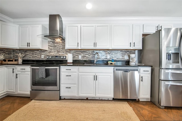 kitchen with sink, appliances with stainless steel finishes, ventilation hood, white cabinets, and decorative backsplash