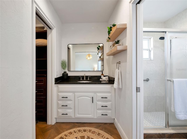 bathroom with vanity and an enclosed shower