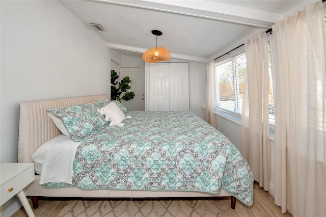 bedroom with a closet and light wood-type flooring