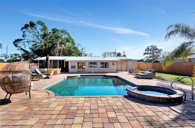 view of pool with a patio area, outdoor lounge area, and an in ground hot tub