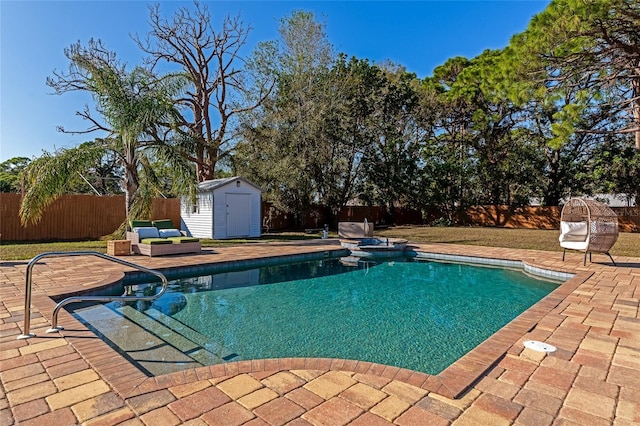 view of swimming pool featuring a patio and a storage unit