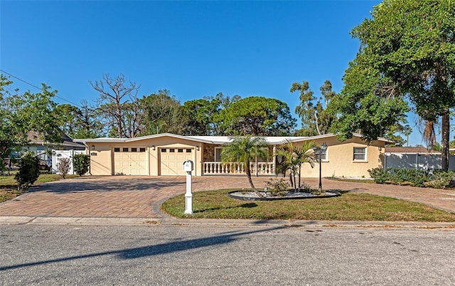 ranch-style house featuring a garage