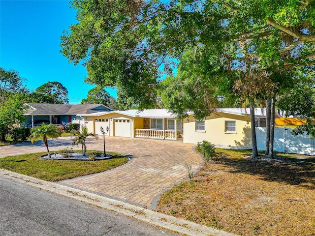 ranch-style home with a garage