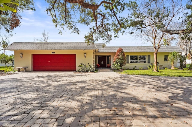 ranch-style home featuring a garage