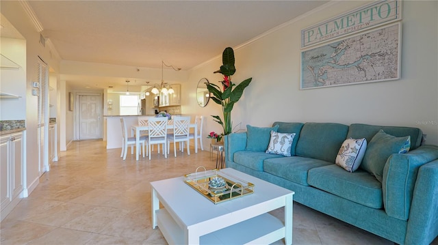 living area featuring a chandelier and crown molding