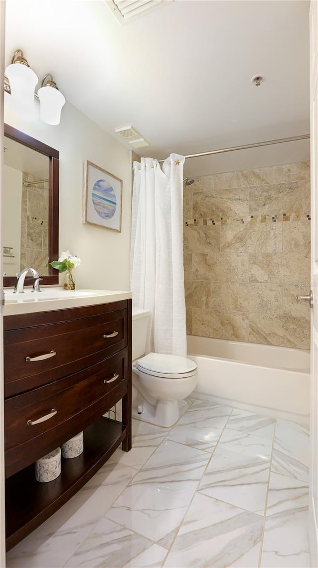 bathroom featuring toilet, marble finish floor, shower / bath combination with curtain, and vanity