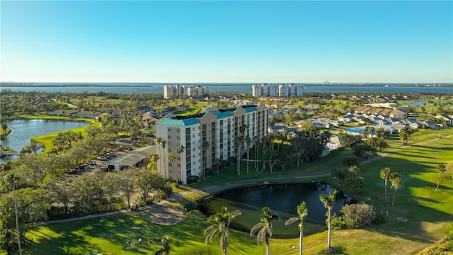 birds eye view of property with a view of city and a water view