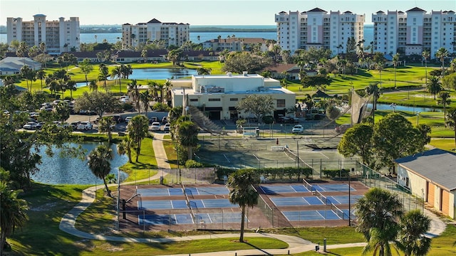 drone / aerial view featuring a water view and a city view