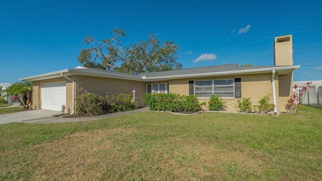 ranch-style home with a garage and a front yard