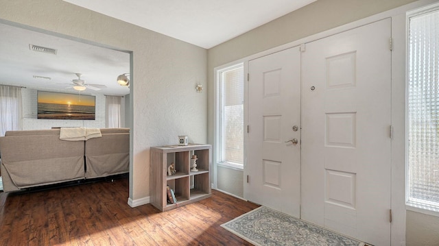 entrance foyer featuring dark wood-type flooring and ceiling fan