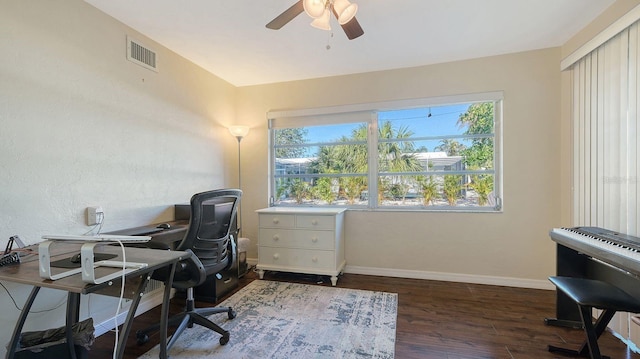 home office with dark hardwood / wood-style floors and ceiling fan