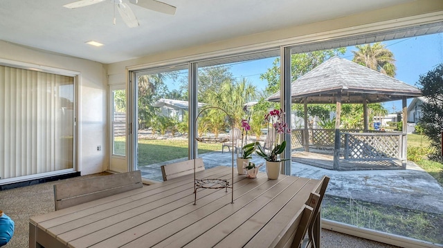 sunroom / solarium with ceiling fan