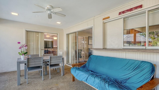 sunroom / solarium featuring ceiling fan