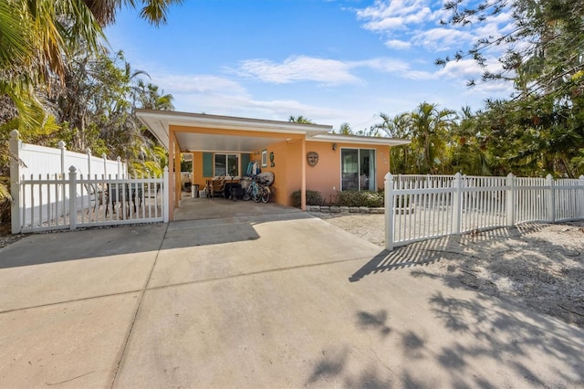 view of front of property featuring a carport