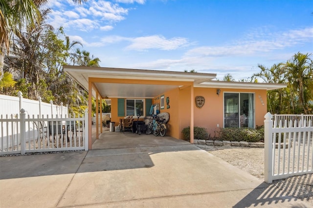 view of front of home featuring a carport