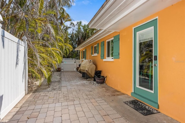 view of side of property featuring a patio