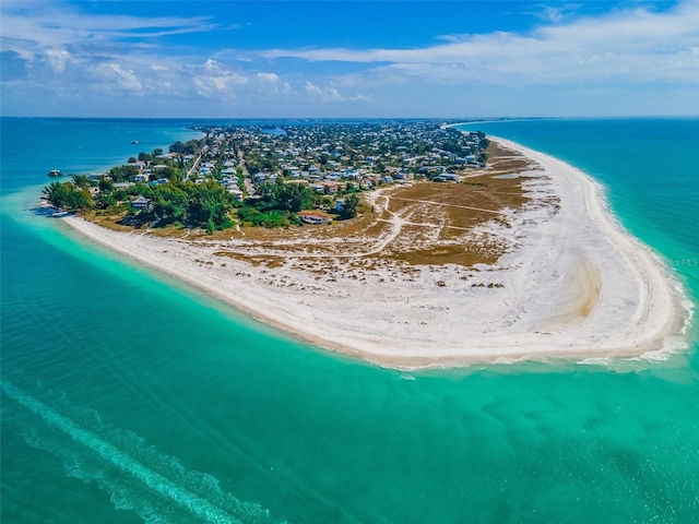 bird's eye view featuring a water view and a view of the beach