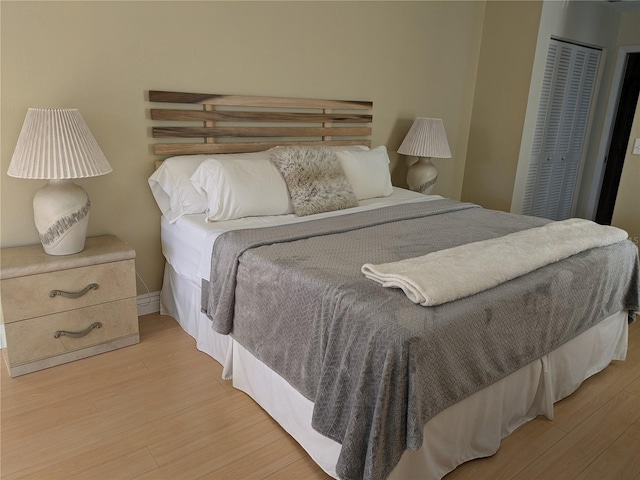 bedroom featuring a closet and wood finished floors