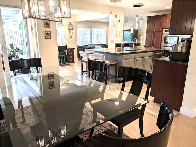 dining space with light wood-type flooring