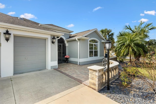 ranch-style home featuring a garage