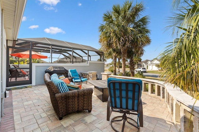 view of patio / terrace featuring an outdoor living space and a lanai