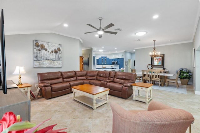 living room featuring lofted ceiling, ceiling fan with notable chandelier, and ornamental molding