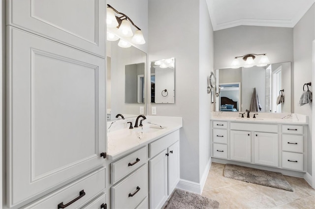 bathroom featuring vanity, crown molding, and tile patterned floors