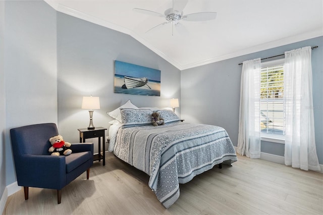 bedroom with ceiling fan, ornamental molding, lofted ceiling, and light hardwood / wood-style flooring