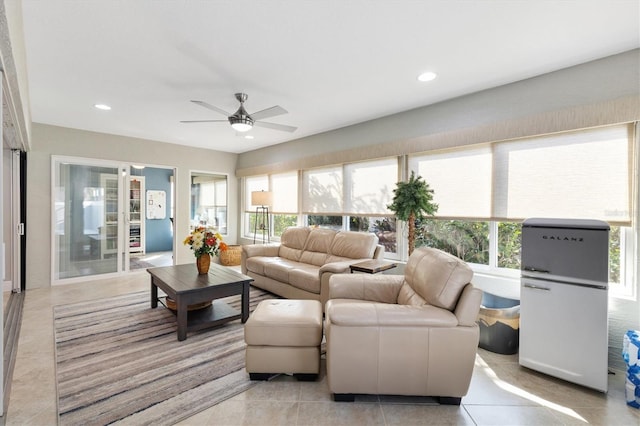 sunroom featuring ceiling fan and a wealth of natural light