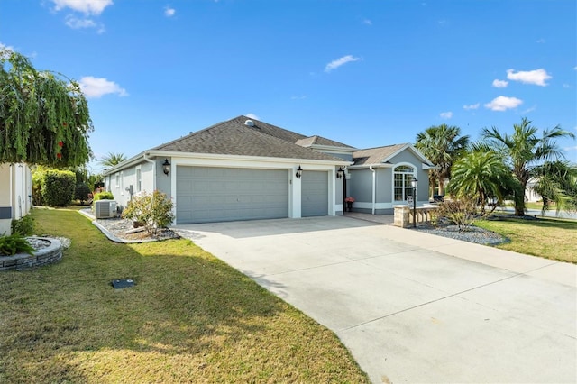 single story home featuring cooling unit, a garage, and a front lawn