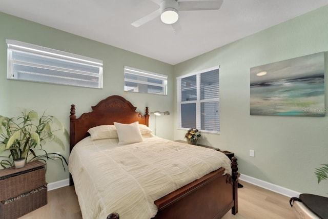 bedroom featuring light wood-type flooring and ceiling fan