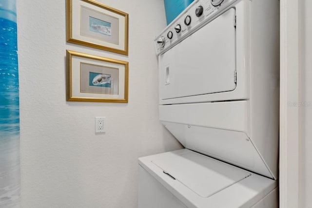 laundry room featuring stacked washer / dryer