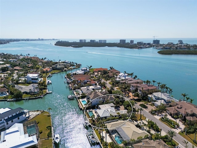 birds eye view of property with a residential view and a water view