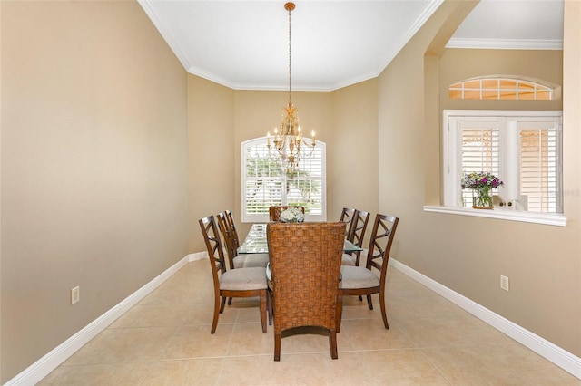 dining space featuring crown molding, baseboards, and light tile patterned floors