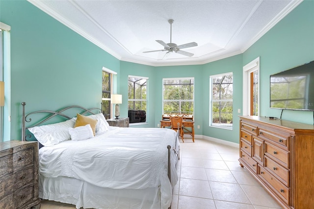 bedroom with ornamental molding, a ceiling fan, baseboards, and light tile patterned floors