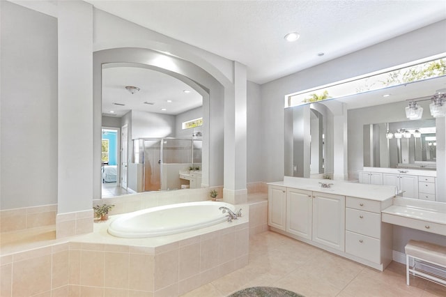 full bathroom with a garden tub, recessed lighting, a shower stall, vanity, and tile patterned floors